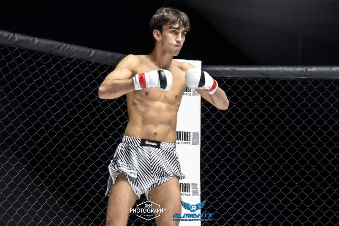 Shot of a fighter from behind wearing a 4 Eleven printed shorts